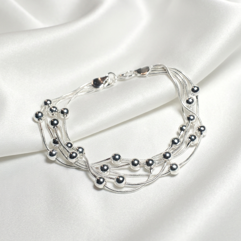 Купити срібний браслет жіночий 925 проба. 20 см, родоване срібло. Безкоштовна доставка. Багатошаровий браслет з срібними кульками.
