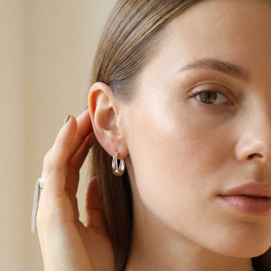 Minimalist sterling silver ring with dangling chain charms styled on model