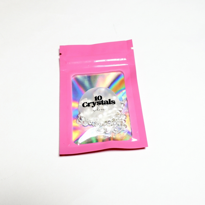 Рожевий зіп пакет 10 Crystals на білому фоні