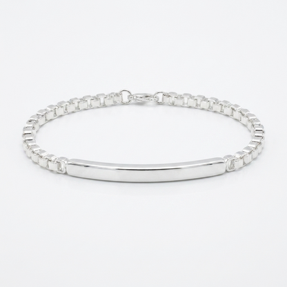 Срібний унісекс браслет, що поєднує масивний ланцюговий плетіння та гладку центральну пластину. Безкоштовна доставка по Україні. Швидка відправка.