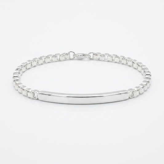 Срібний унісекс браслет, що поєднує масивний ланцюговий плетіння та гладку центральну пластину. Безкоштовна доставка по Україні. Швидка відправка.