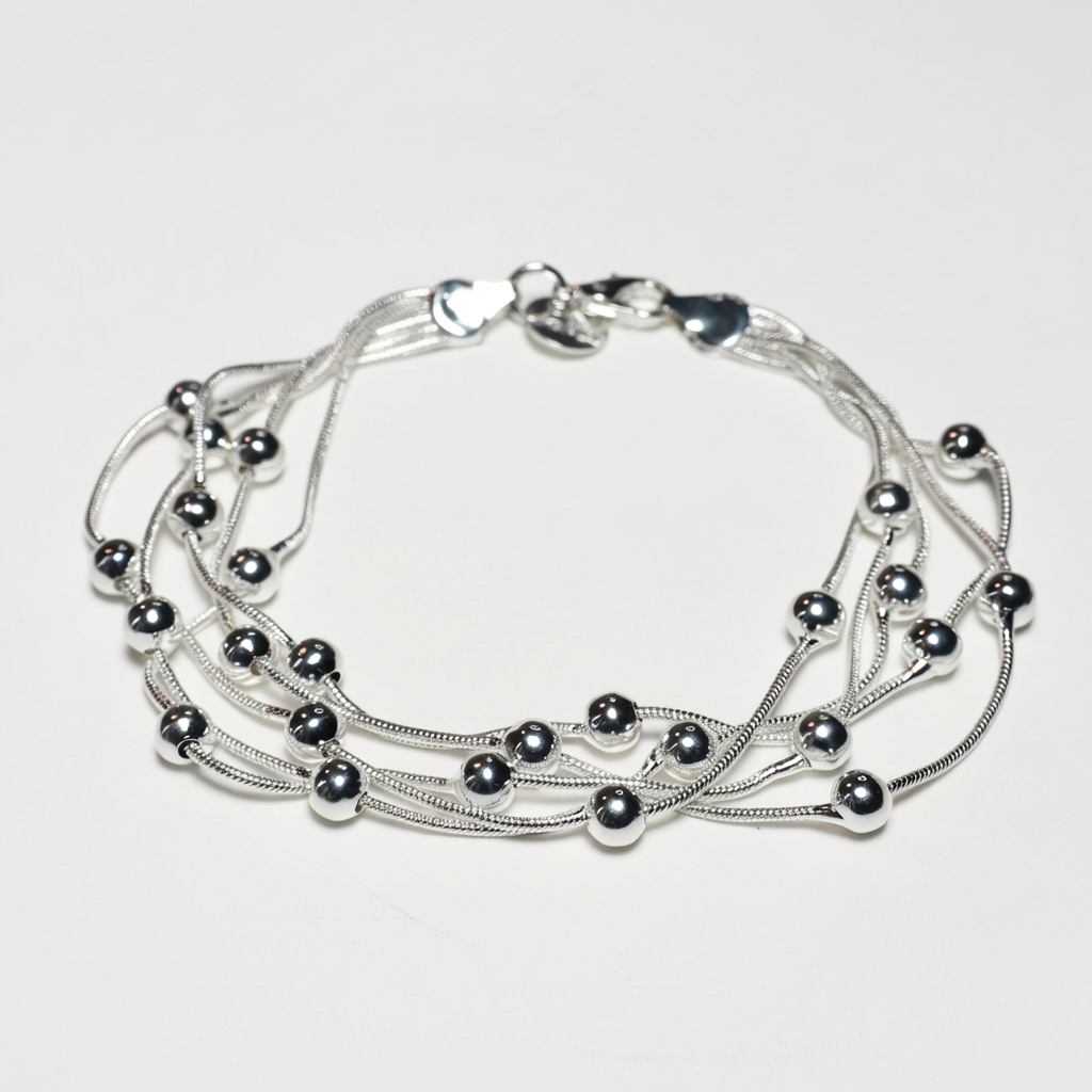 Срібний браслет багатошаровий для жінок — кульковий каскад. Родоване срібло. Безкоштовна доставка.